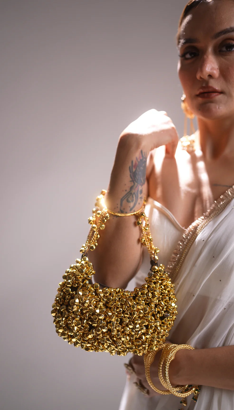 Gold ghungroo crescent bag with circular handle – Clutch It Handbags