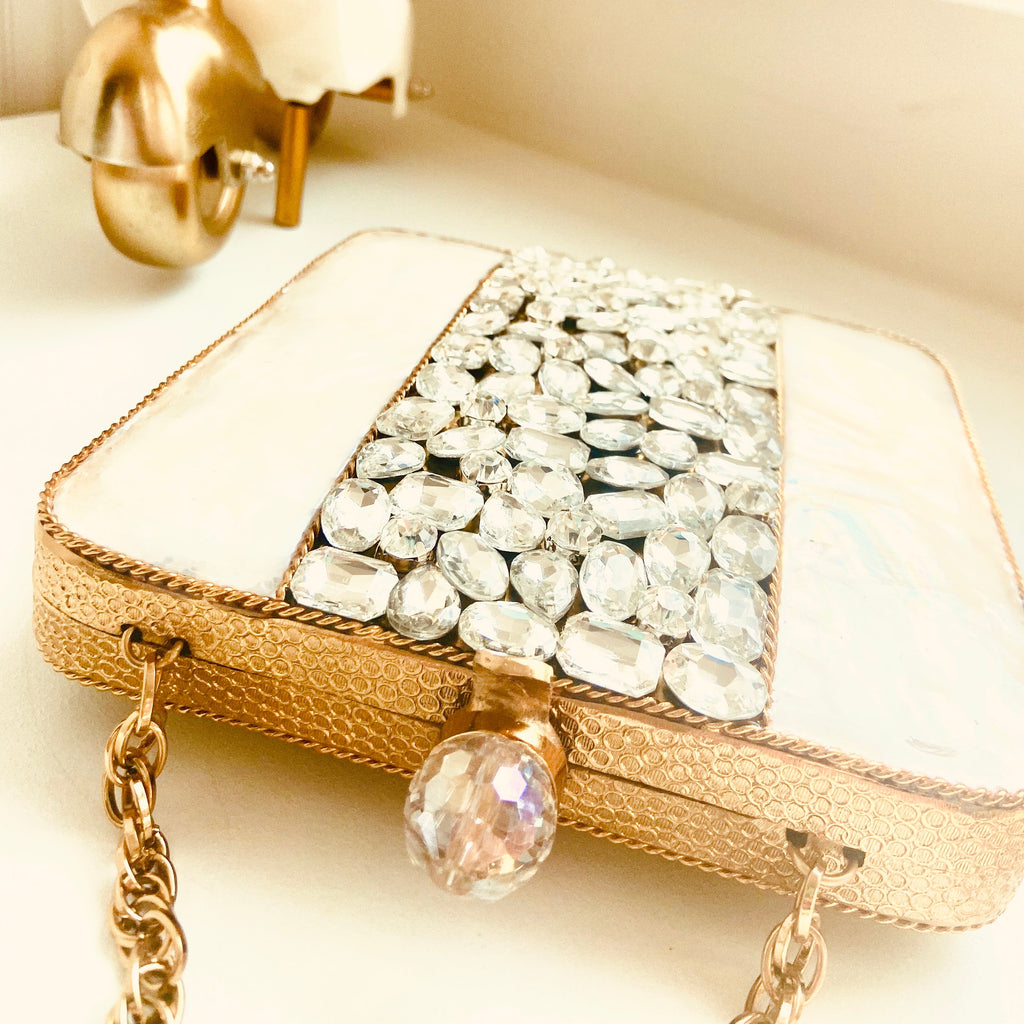 paris clutch purse lying down